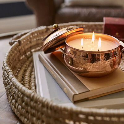 Thymes Simmered Cider Copper Pot 3 Wick Candle on Coffee Table